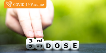 A set of white dice read "3rd dose" referring to the COVID-19 vaccine booster