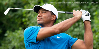 Professional golfer Tiger Woods swings a golf club.