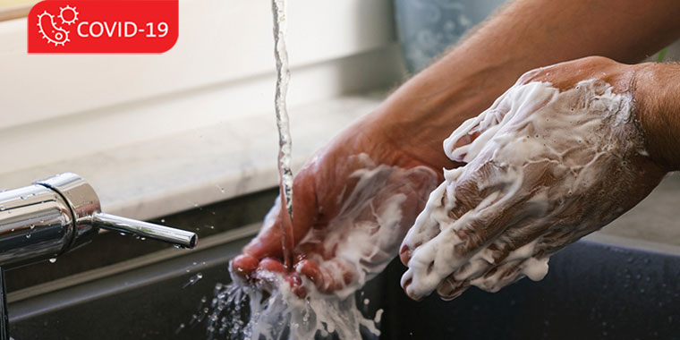 Individual washing their hands 