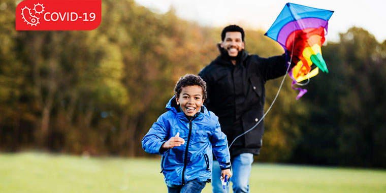 Father and son flying a kite