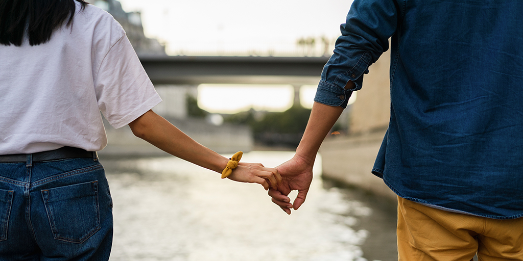 Couple holding hands