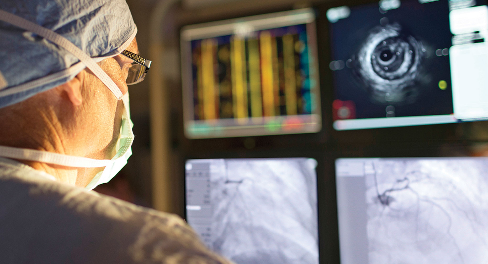 A cardiologist studies heart arrhythmia on screen